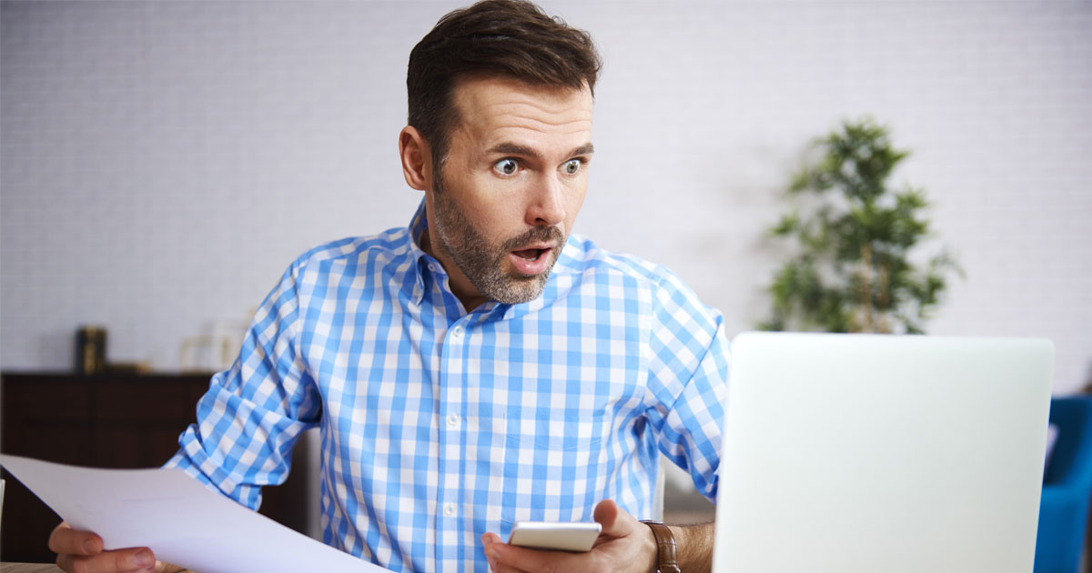 Shocked and worried businessman at work 